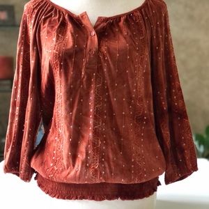 Long sleeved sequined blouse.